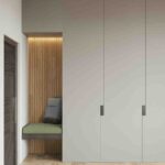 Elegant wooden customized wardrobe with mirror doors and organized shelving in Perinthalmanna residence