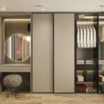 Custom-designed wardrobe with organized compartments and modern finishes installed in Perinthalmanna home